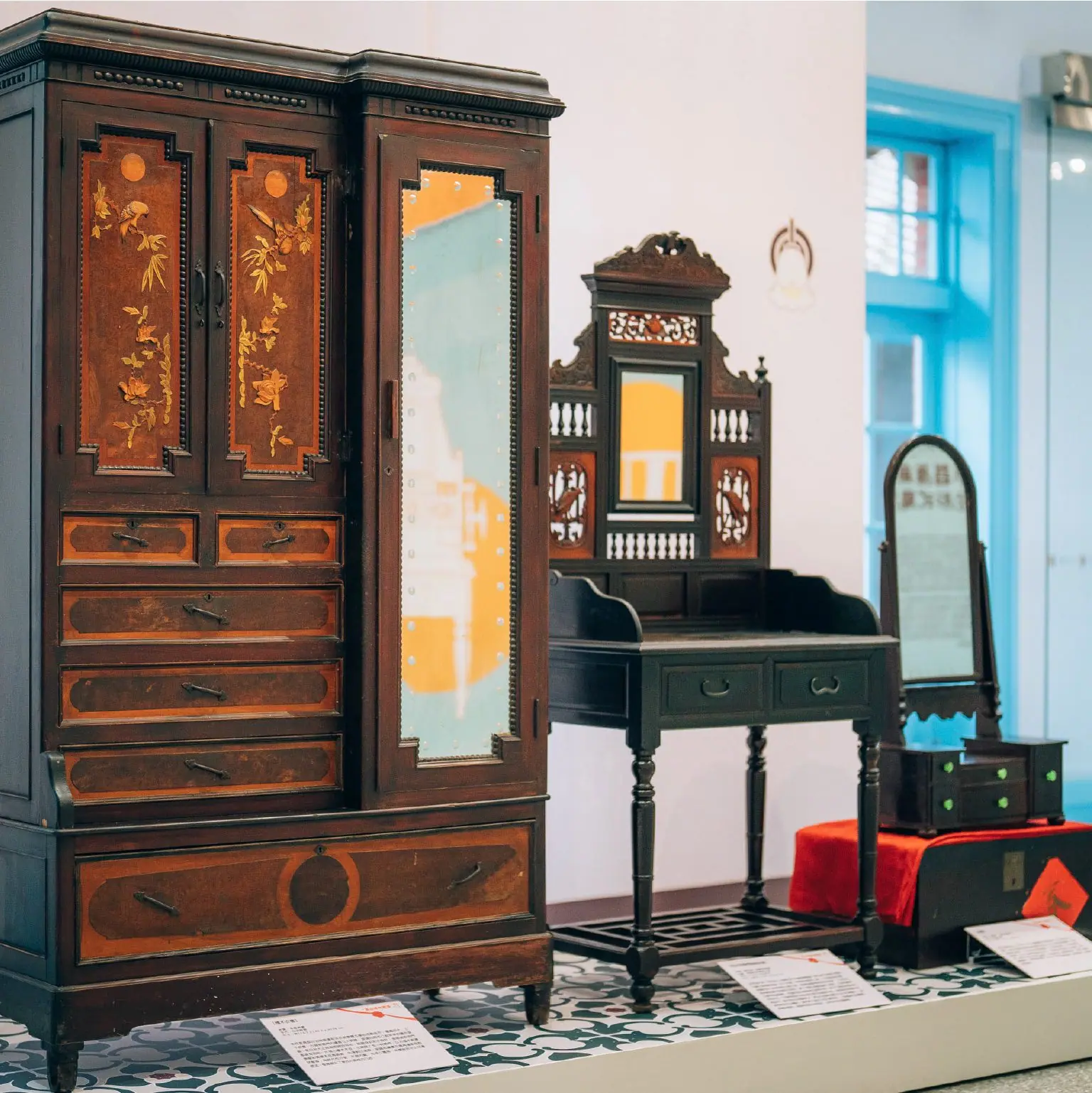 Detail of dowry furniture in the exhibition, close-up of a carved wardrobe and dressing table