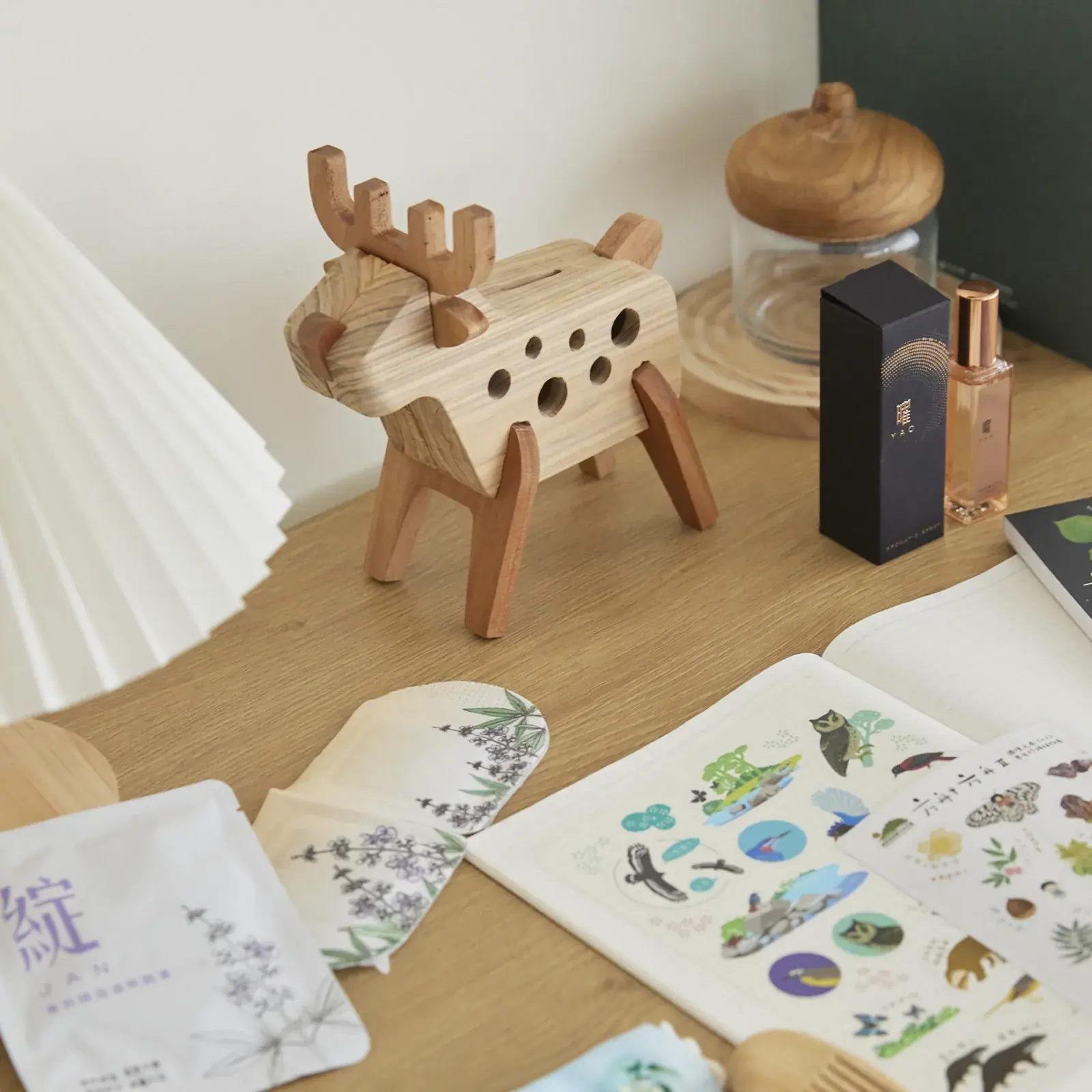 Forest Made wooden deer coin bank and forest-themed merchandise styled shot | Howdy Creative