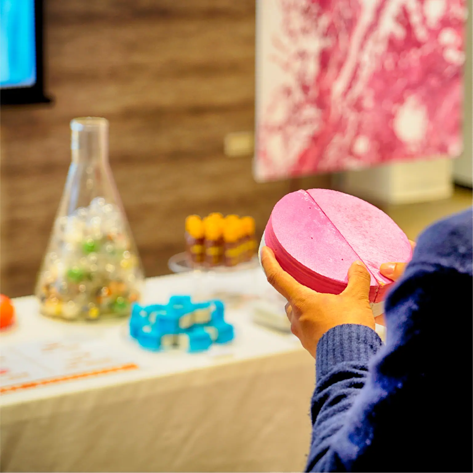 Visitors taking part in the herbal medicine draw interactive installation at the Sincere Faith Heals exhibition